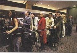 C1 Advanced Speaking - Travellers queuing inside