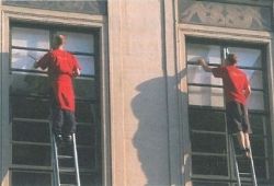 C1 Advanced Speaking Part 2 - 2 men in red overalls cleaning high windows