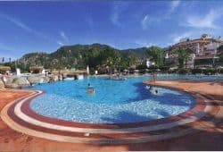 A sunny swimming pool with mountains in the background - B2 First Speaking Part 2