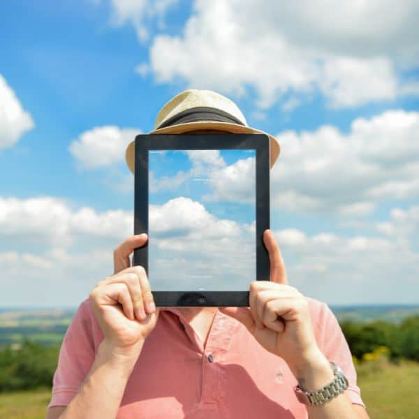 Faceless person outside on a sunny day